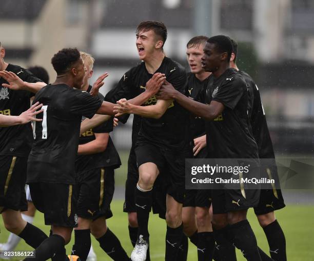 Oisin McEntee of Newcastle United celebrates with team mates after opening the scoring with a header during the Super Cup NI u18 tournament group...