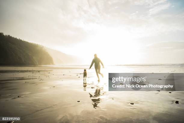 monochrome, running on the oregon coast - cape lookout national seashore stock pictures, royalty-free photos & images