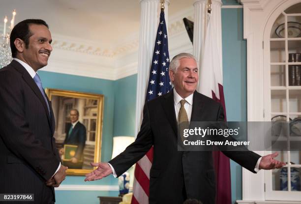 With Qatari Foreign Minister Sheikh Mohammed Bin Abdulrahman Al Thani looking on, U.S. Secretary of State Rex Tillerson responds to a question during...