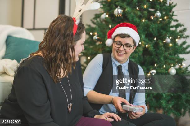 holiday couple - gay santa claus stock pictures, royalty-free photos & images