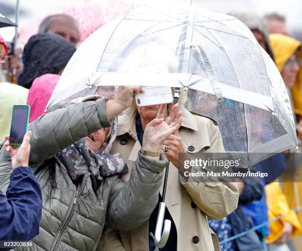 Member of the public takes a 'selfie' with Camilla, Duchess of Cornwall as she visits the Sandringham Flower Show in the grounds of Sandringham House...