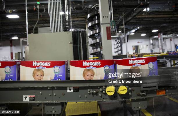Boxes of Huggies brand diapers move along a conveyor belt at the Kimberly-Clark Corp. Manufacturing facility in Paris, Texas, U.S, on Tuesday, Oct....
