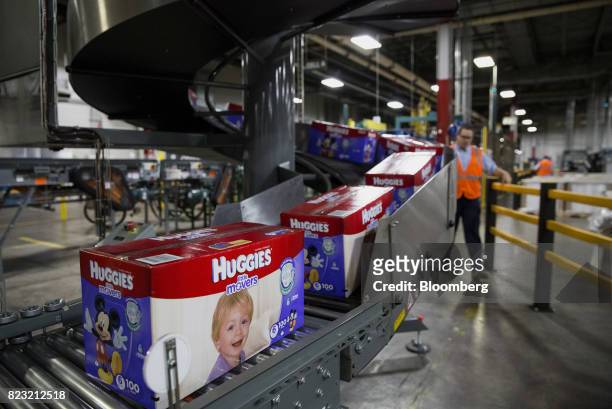 Boxes of Huggies brand diapers move along a conveyor belt at the Kimberly-Clark Corp. Manufacturing facility in Paris, Texas, U.S, on Tuesday, Oct....