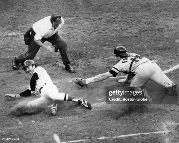 Red Sox Jerry Remy gets out at home base during a game against the Detroit Tigers at Fenway Park in Boston, June 21, 1979.