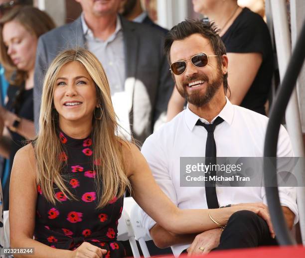 Jennifer Aniston and Justin Theroux attend the ceremony honoring Jason Bateman with a Star on The Hollywood Walk of Fame held on July 26, 2017 in...