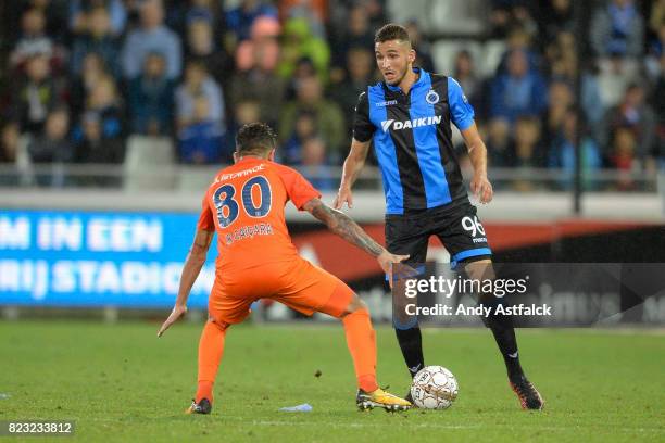 In the foreground Junior Caicara from Istanbul Basaksehir defends against Ahmed Touba from Club Brugge during the Champions League Third Round...