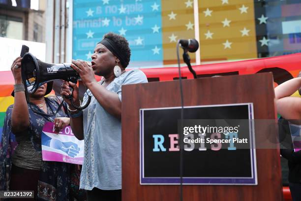 Transgender Army veteran Tanya Walker speaks to protesters in Times Square near a military recruitment center as they show their anger at President...