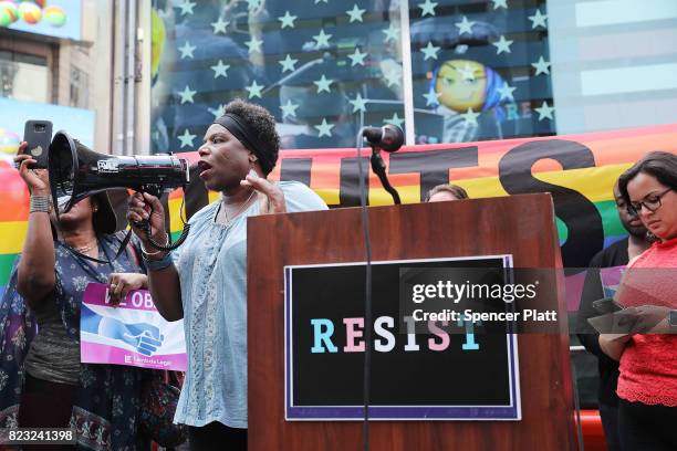 Transgender Army veteran Tanya Walker speaks to protesters in Times Square near a military recruitment center as they show their anger at President...