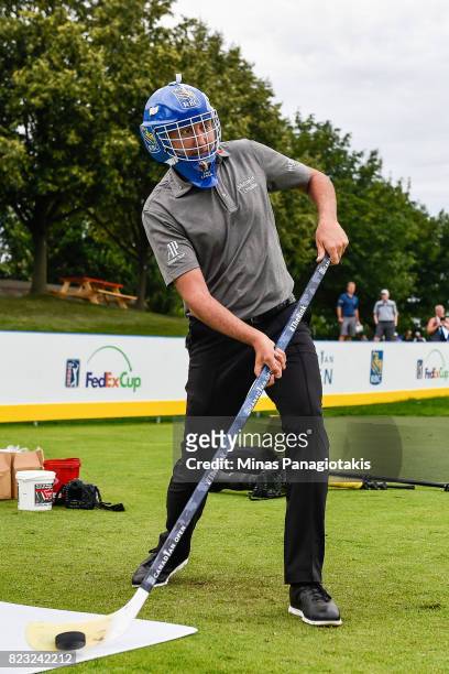 Ian Poulter of England attempts a shot in hockey during the championship pro-am of the RBC Canadian Open at Glen Abbey Golf Course on July 26, 2017...