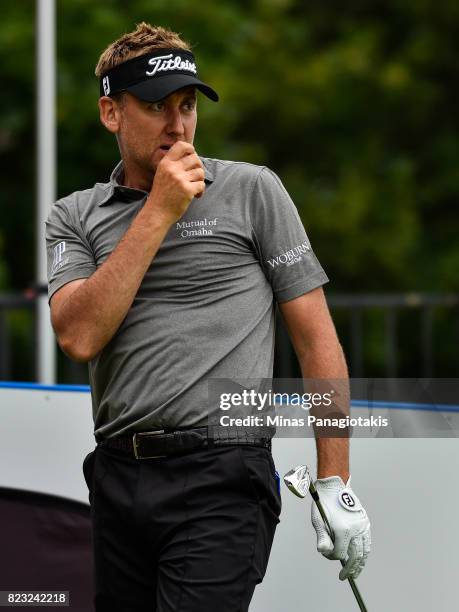 Ian Poulter of England looks on after hitting a tee shot on the seventh hole during the championship pro-am of the RBC Canadian Open at Glen Abbey...