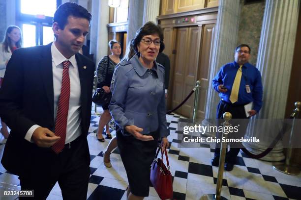 Sens. Brian Schatz and Susan Collins head for the Senate Floor for a vote at the U.S. Capitol July 26, 2017 in Washington, DC. GOP efforts to pass...