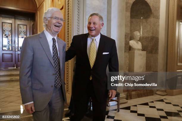 Sens. Thad Cochran and Richard Burr share a laugh as they walk off the Senate Floor following a vote at the U.S. Capitol July 26, 2017 in Washington,...