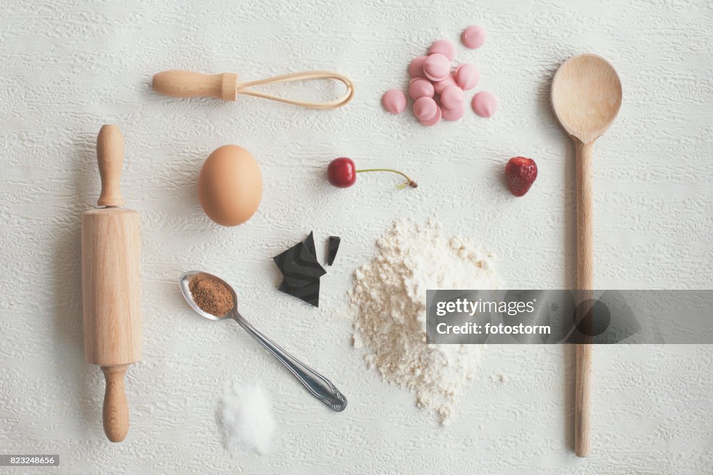 Kitchen utensils and food on white background - knolling