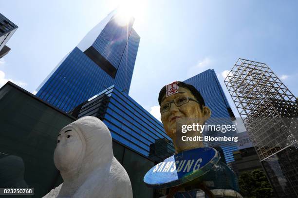 An effigy of Jay Y. Lee, co-vice chairman of Samsung Electronics Co., stands outside the Samsung Seocho office building in Seoul, South Korea, on...