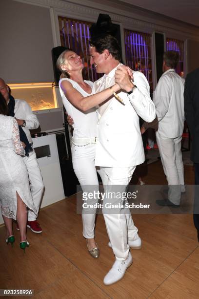 Axel Ludwig and Sibylle Schoen dance during the Hotel Vier Jahreszeiten summer party 'Eclat Dore' on July 26, 2017 in Munich, Germany.