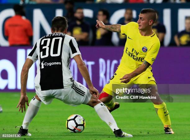 Marco Verratti of Paris Saint-Germain vie for possession with Rodrigo Bentancur of Juventus in the first half during their International Champions...