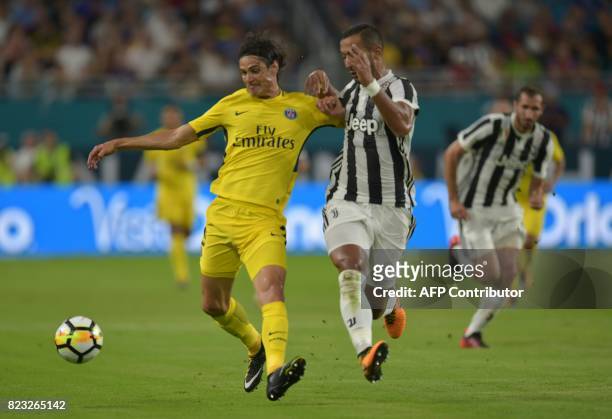 Edinson Cavani of Paris Saint-Germain controls the ball before Medhi Benatia of Juventus during their International Champions Cup friendly match at...
