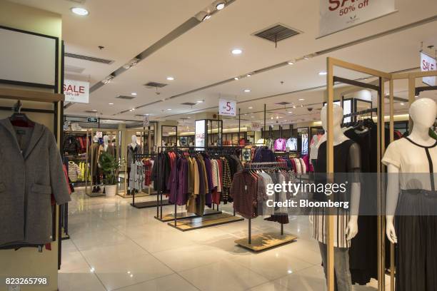 Clothes hang on display inside the Bosideng International Holdings Ltd. Flagship clothing store in Shanghai, China, on Friday, July 14, 2017....