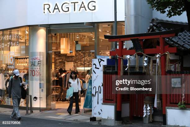 Shopper exits a Ragtag store, operated by Tin Pan Alley Co., in the Umeda shopping area of Osaka, Japan, on Wednesday, July 26, 2017. Japan is...