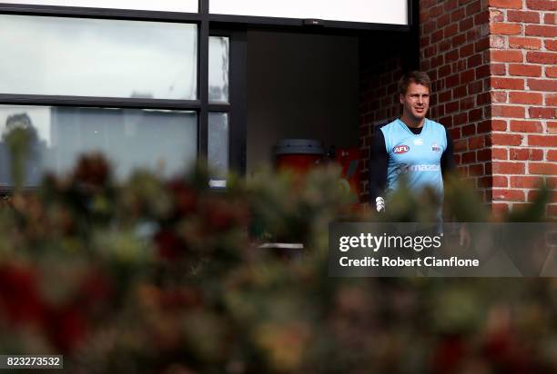 Andrew Swallow of the Kangaroos walks out for a North Melbourne Kangaroos AFL training session at Arden Street Ground on July 27, 2017 in Melbourne,...