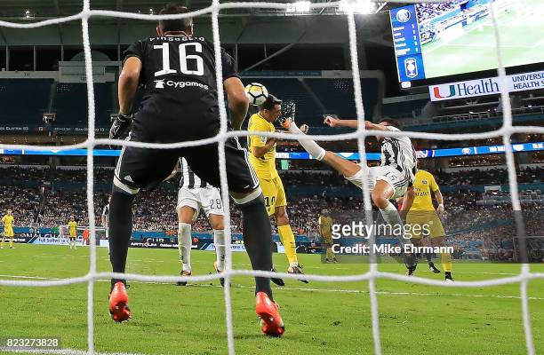 Javier Pastore of Paris Saint-Germain scores a goal on Carlo Pinsoglio of Juventus during the International Champions Cup 2017 match against the...