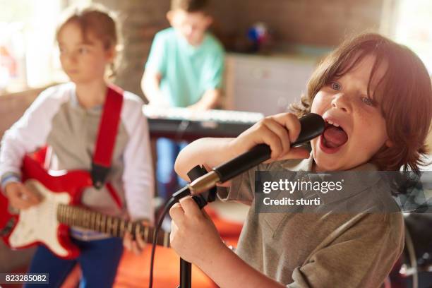 band rehearsal - boy singing stock pictures, royalty-free photos & images