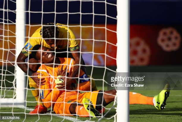 Alvas Powell of Jamaica looks after Andre Blake of Jamaica after Blake was injured during the 2017 CONCACAF Gold Cup Final against the the United...