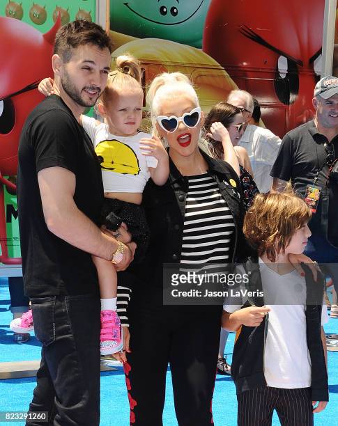 Christina Aguilera, Matthew Rutler, Max Liron Bratman and Summer Rain Rutler attend the premiere of "The Emoji Movie" at Regency Village Theatre on...