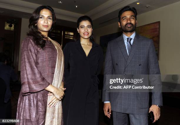 Indian Bollywood actress Kajol Devgn and South Indian actor Dhanush pose for a photograph during a promotional event for the forthcoming Hindi film...