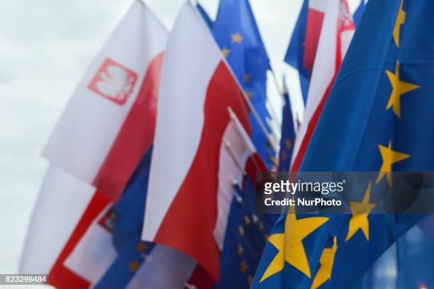 Polish and EU flags for sale near Krakow's District Court ahead of an anti-government candle-lit vigil on Wednesday evening where hundreds gathered...
