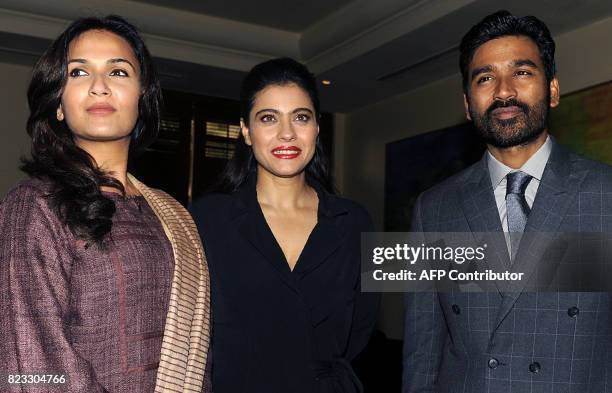 Indian Bollywood actress Kajol Devgn and South Indian actor Dhanush pose for a photograph during a promotional event for the forthcoming Hindi film...