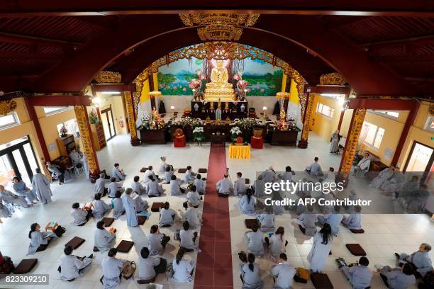 People pray in the 'biggest pagoda in Europe' during a seminar of the Vietnamese congregation gathering Buddhists coming from the entire world, in...