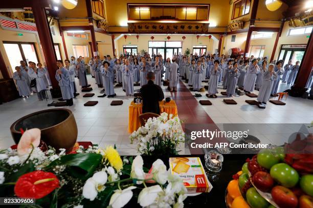 Monk leads worshippers in the 'biggest pagoda in Europe' during a seminar of the Vietnamese congregation gathering Buddhists coming from the entire...