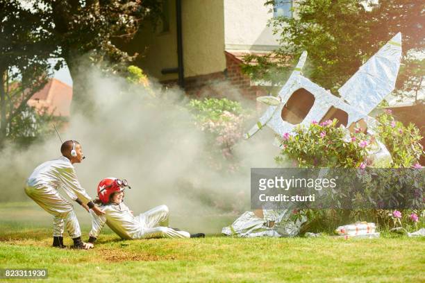 spaceboy crash landing - rocket landing stock pictures, royalty-free photos & images