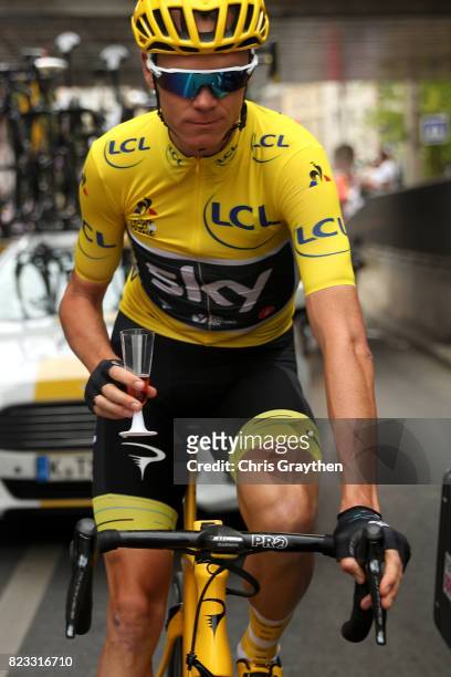 Christopher Froome of Great Britain riding for Team Sky in the yellow leader's jersey celebrates his fourth General Classification overall victory...
