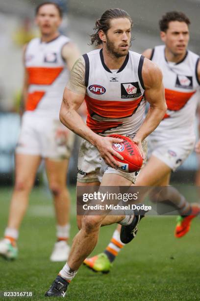 Callan Ward of the Giants runs with the ball during the round 18 AFL match between the Richmond Tigers and the Greater Western Sydney Giants at...