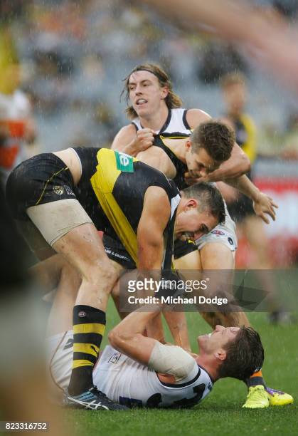 Ivan Soldo of the Tigers wrestles over Aidan Corr of the Giants during the round 18 AFL match between the Richmond Tigers and the Greater Western...