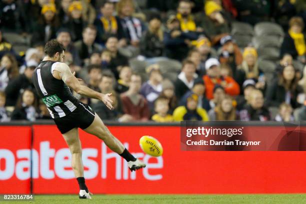 Alex Fasolo of the Magpies kicks the final goal of the game during the round 18 AFL match between the Collingwood Magpies and the West Coast Eagles...