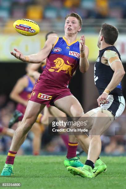 Alex Witherden of the Lions catches the ball during the round 18 AFL match between the Brisbane Lions and the Carlton Blues at The Gabba on July 23,...