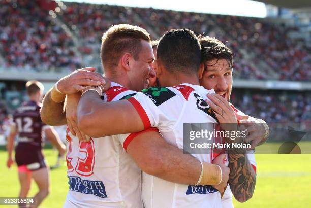Timoteo Lafai of the Dragons is congratulated by team mates after scoring during the round 20 NRL match between the St George Illawarra Dragons and...