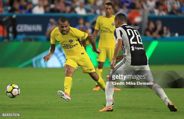 Jese of Paris Saint-Germain passes past Tomas Rincon of Juventus during the International Champions Cup 2017 match at Hard Rock Stadium on July 26,...