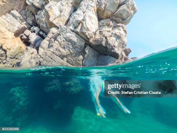 man diving into water in ionian sea, greece - mar jónico fotografías e imágenes de stock