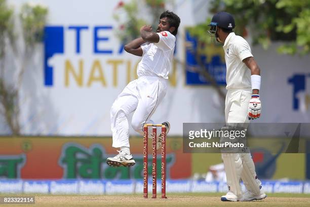 Sri Lankan cricketer Nuwan Pradeep leaps in the air while delivering a ball during the 2nd Day's play in the 1st Test match between Sri Lanka and...