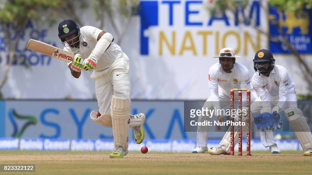 Indian cricketer Ravichandran Ashwin plays a shot during the 2nd Day's play in the 1st Test match between Sri Lanka and India at the Galle...