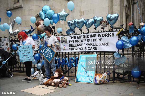 Supporters of terminally ill baby Charlie Gard protest outside the High Court as the verdict is announced on July 24, 2017 in London, England. The...