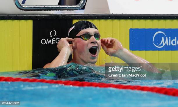 Adam Peaty of Great Britain reacts as he breaks the world record during the Mens 50m Breaststroke semi final during day twelve of the FINA World...