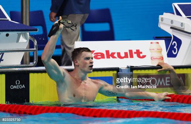 Adam Peaty of Great Britain celebrates winning the final of Men's 100m Breaststroke on day eleven of the FINA World Championships at the Duna Arena...
