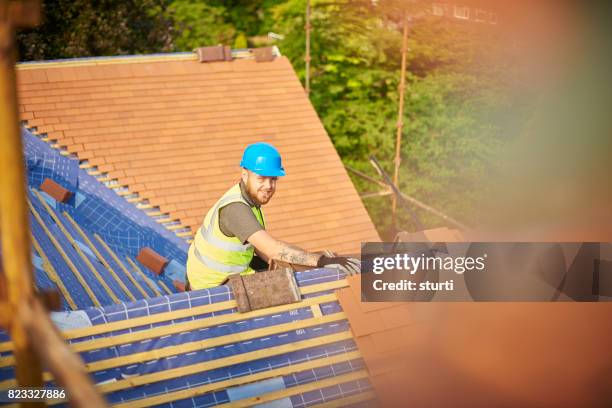 happy roofer - roofer stock pictures, royalty-free photos & images
