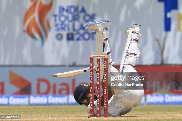 Indian cricketer Hardik Pandya loses his balance while batting during the 2nd Day's play in the 1st Test match between Sri Lanka and India at the...