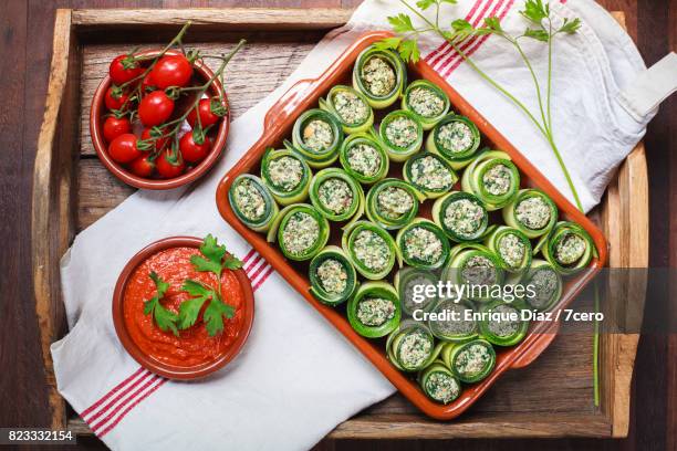 zucchini cannellonis with romesco and cherry tomatoes - cannelloni stock pictures, royalty-free photos & images